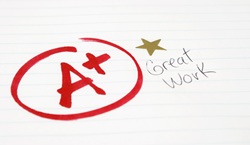 A+ result on sheet of paper with the words 'great work'