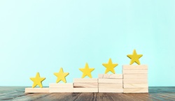 Five stars on wooden blocks